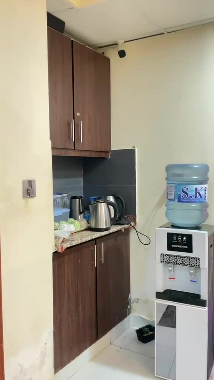 Kitchen with kettle and water dispenser